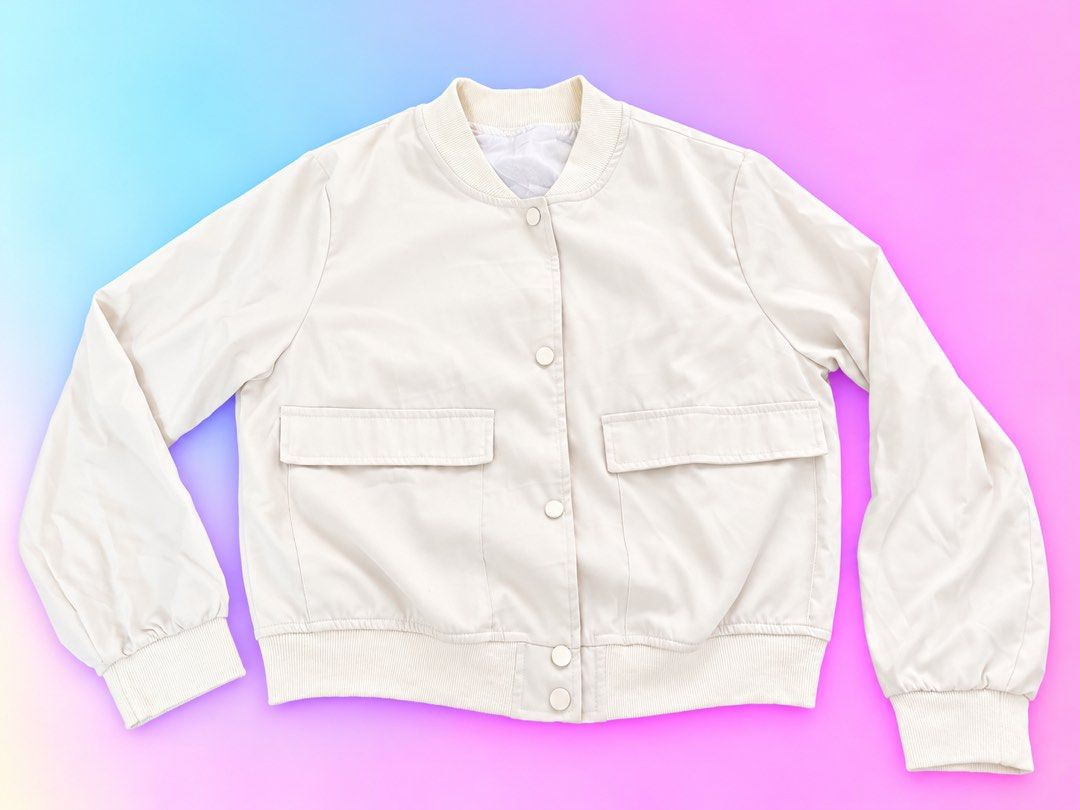 Off-White Bomber Jacket with Flap Pockets and Snap Buttons (Category: Coats, Jackets and Outerwear) located in Quezon City. Submitted by turtleandfishes (Listing ID 1468734202, Image 1). Description: - Color: Off-white - Material: Lightweight and easy to layer - Closure: Snap button front - Pockets: Two front flap pockets at the chest - Details: Ribbed collar, cuffs, and hem - Measurements: Pit to pit ~21 inches, Length ~22 inches.
