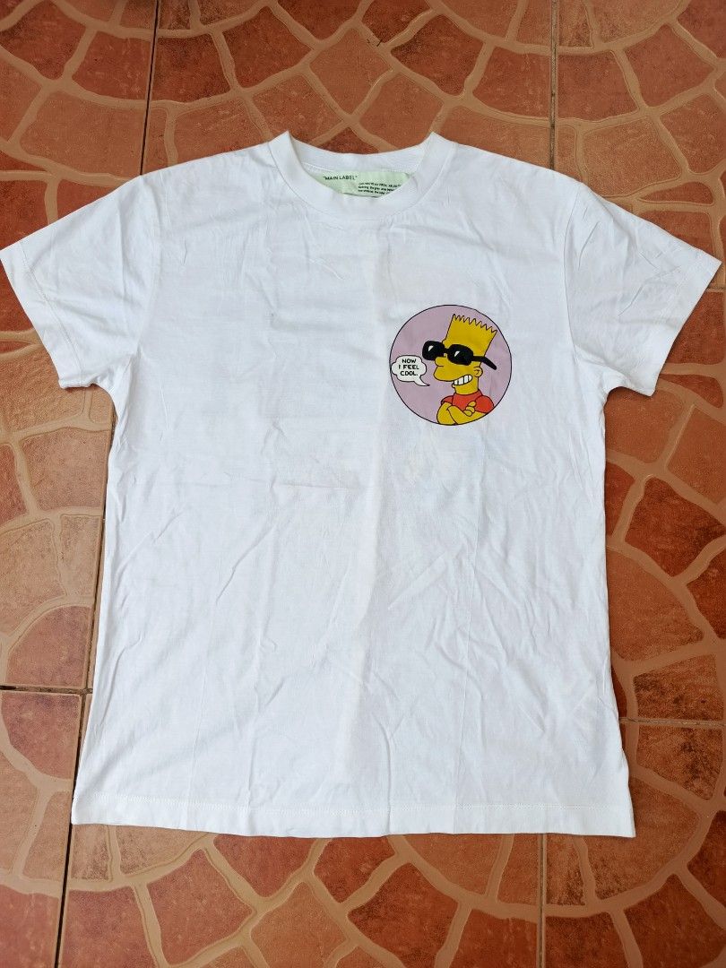 Off-White Virgil Abloh Bart Simpson Public Enemy T-shirt (Category: Tshirts & Polo Shirts ) located in Dipolog. Submitted by just_thriftfinds (Listing ID 1468750606, Image 1). Description: - Brand: Off-White (with Virgil Abloh Main Label neck tag) - Material: Premium white cotton - Condition: Good, with a small faint yellowish stain near the front collar area - Style: Rare streetwear collectible Dimes: 18/25.
