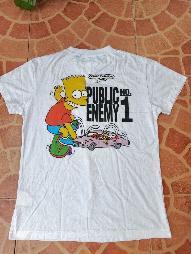 Off-White Virgil Abloh Bart Simpson Public Enemy T-shirt (Category: Tshirts & Polo Shirts ) located in Dipolog. Submitted by just_thriftfinds (Listing ID 1468750606, Image 2). Description: - Brand: Off-White (with Virgil Abloh Main Label neck tag) - Material: Premium white cotton - Condition: Good, with a small faint yellowish stain near the front collar area - Style: Rare streetwear collectible Dimes: 18/25.