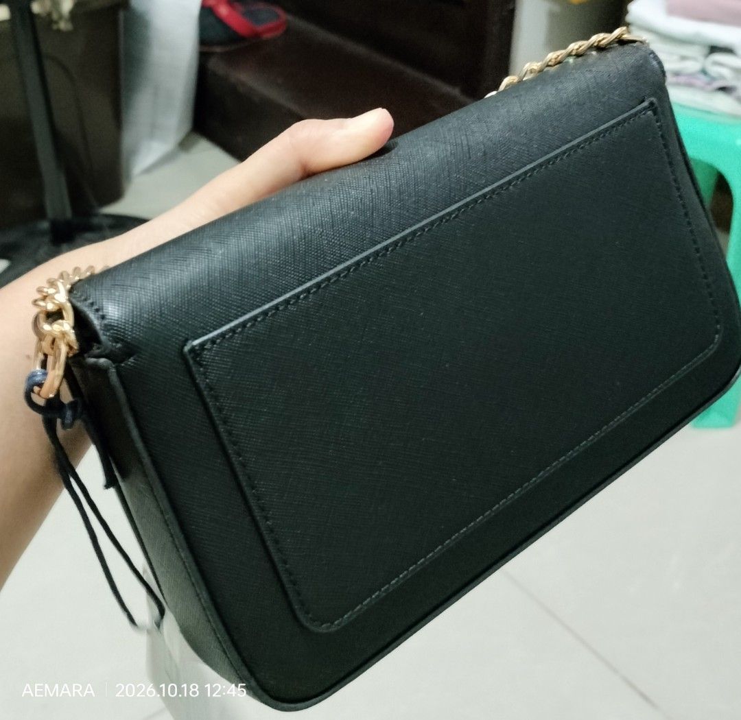 OG USPA Black Flap Bag (Category: Cross-body Bags) located in Caloocan City. Submitted by almaeternamara (Listing ID 1468923328, Image 3). Description: Women's crossbody bag in blue color, made of high-quality eco-friendly leather. Internally, it is made of fabric lining and its storage space consists of two parts. It features an internal pocket with a zipper. Gold metal detail on the front with the US Polo Assn. logo. Secure closure with a magne