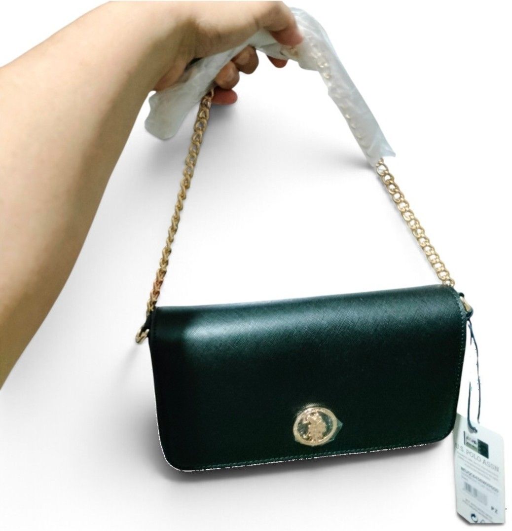 OG USPA Black Flap Bag (Category: Cross-body Bags) located in Caloocan City. Submitted by almaeternamara (Listing ID 1468923328, Image 1). Description: Women's crossbody bag in blue color, made of high-quality eco-friendly leather. Internally, it is made of fabric lining and its storage space consists of two parts. It features an internal pocket with a zipper. Gold metal detail on the front with the US Polo Assn. logo. Secure closure with a magne