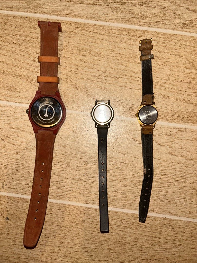 Old Analog Wristwatches (Category: Women's Watches) located in Manila. Submitted by _zzaney (Listing ID 1468849524, Image 2). Description: - old analog watches - Watch 1: Jack Spade with orange face and red/brown patterned strap. Issue: foggy glass - Watch 2: Casio. Black. Missing other half strap - Watch 3: Casio with classic gold-tone case and brown leather strap. Strap is was replaced - Condition: heavily used. - Great bundle deal for watch co