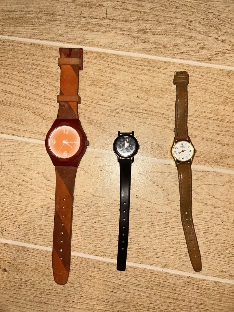 Old Analog Wristwatches (Category: Women's Watches) located in Manila. Submitted by _zzaney (Listing ID 1468849524, Image 1). Description: - old analog watches - Watch 1: Jack Spade with orange face and red/brown patterned strap. Issue: foggy glass - Watch 2: Casio. Black. Missing other half strap - Watch 3: Casio with classic gold-tone case and brown leather strap. Strap is was replaced - Condition: heavily used. - Great bundle deal for watch co