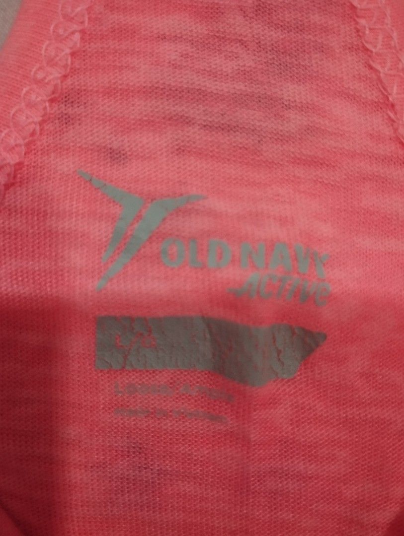 Old Navy Active Pink Tank Top Size L (Category: Sleeveless) located in Dagupan City. Submitted by nahamul_1508 (Listing ID 1468902269, Image 3). Description: Preloved - Brand: Old Navy Active - Color: Neon pink with black straps - Size: Large (printed inside neckline) - Design: Racerback with thick black cross straps at the back - Material: Lightweight with a slight heathered look - Condition/Use: Great for workouts, gym sessions, or casual wear 