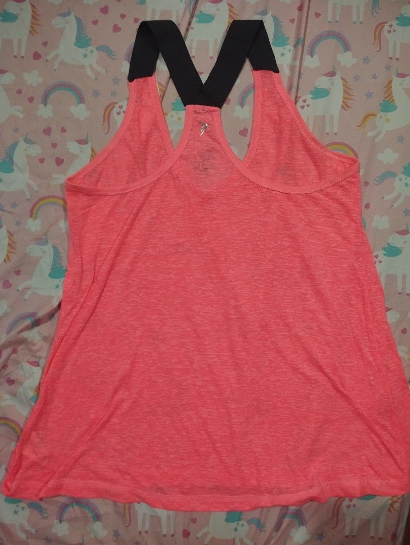 Old Navy Active Pink Tank Top Size L (Category: Sleeveless) located in Dagupan City. Submitted by nahamul_1508 (Listing ID 1468902269, Image 2). Description: Preloved - Brand: Old Navy Active - Color: Neon pink with black straps - Size: Large (printed inside neckline) - Design: Racerback with thick black cross straps at the back - Material: Lightweight with a slight heathered look - Condition/Use: Great for workouts, gym sessions, or casual wear 