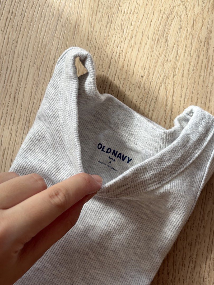 Old Navy Grey Ribbed Tank Top (Category: Sleeveless) located in Makati City. Submitted by sbllia (Listing ID 1468771214, Image 2). Description: - Brand: Old Navy - Used once - Bought in the US - Color: Light grey - Size: Small (fits true to size) - Material: Soft stretch cotton - Fit: Snug fit with classic scoop neckline and thick straps - Condition: Excellent / Great for everyday wear or layering.