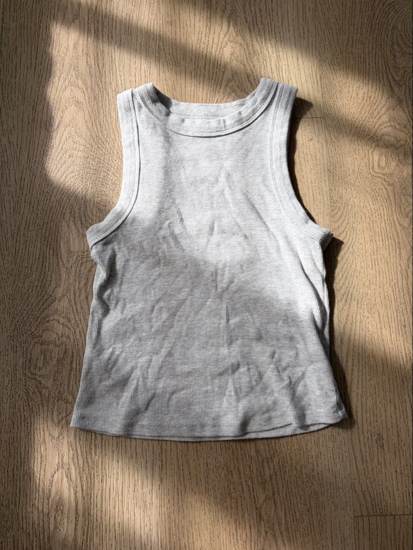 Old Navy Grey Ribbed Tank Top (Category: Sleeveless) located in Makati City. Submitted by sbllia (Listing ID 1468771214, Image 1). Description: - Brand: Old Navy - Used once - Bought in the US - Color: Light grey - Size: Small (fits true to size) - Material: Soft stretch cotton - Fit: Snug fit with classic scoop neckline and thick straps - Condition: Excellent / Great for everyday wear or layering.