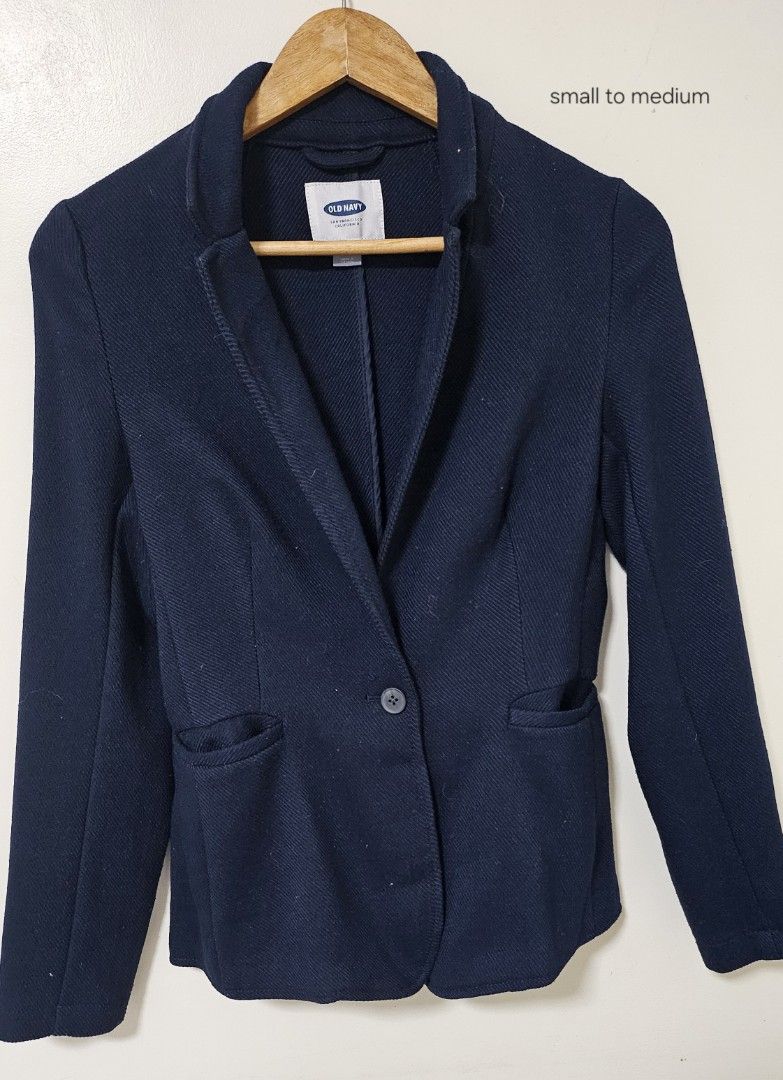 Old Navy Navy Blue Blazer Jacket Small to Medium (Category: Coats, Jackets and Outerwear) located in Laoag. Submitted by __baptistakim (Listing ID 1468831647, Image 1). Description: Old Navy navy blue blazer. Textured fabric with a single button closure on the front. Two front pockets included. Structured collar and long sleeves. Fits size small to medium based on the label and cut. Versatile dark blue shade matches many outfits for work or casua