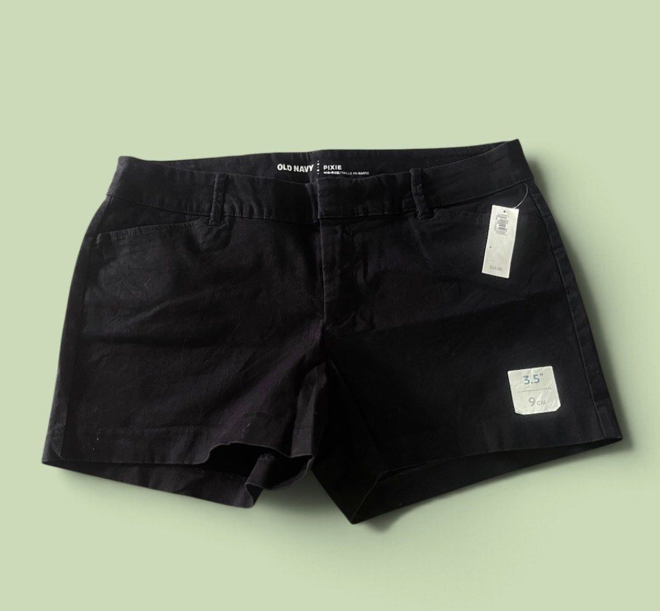 Old Navy Pixie Mid-Rise Black Shorts - Authentic (Category: Shorts) located in San Pedro. Submitted by lifebeginsaftercoff33 (Listing ID 1468742393, Image 2). Description: - Brand: Old Navy (Pixie) - Color: Solid Black - Condition: Brand new with original tags attached - Rise: Mid-rise with hook-and-bar closure and zip fly - Inseam: 3.5 inches - Pockets: Two functional back pockets - Very soft comfy stretchy fabric w/ loop belt - Dimes: 32 x 12 i