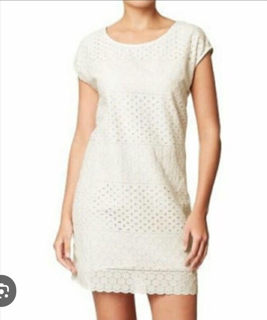 OLD NAVY White Eyelet Shift dress (Category: Dresses) located in Quezon City. Submitted by preloved_by_mariekondo (Listing ID 1468734143, Image 1). Description: Old Navy White Eyelet Shift Dress. This sleeveless mini dress features a straight shift silhouette with multi-patterned horizontal bands of embroidered eyelet lace, a scooped crew neckline, a hidden zippered back, and a delicately scalloped hemline Can fit size SMALL. Dress is American si