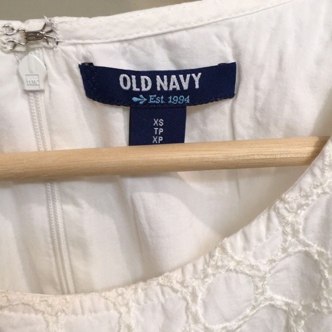 OLD NAVY White Eyelet Shift dress (Category: Dresses) located in Quezon City. Submitted by preloved_by_mariekondo (Listing ID 1468734143, Image 3). Description: Old Navy White Eyelet Shift Dress. This sleeveless mini dress features a straight shift silhouette with multi-patterned horizontal bands of embroidered eyelet lace, a scooped crew neckline, a hidden zippered back, and a delicately scalloped hemline Can fit size SMALL. Dress is American si