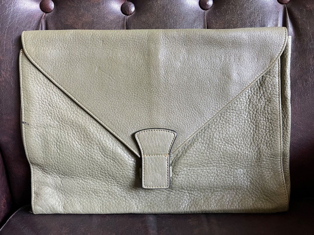 Olive Green Leather Envelope Clutch Bag (Category: Clutches) located in Makati City. Submitted by Ina_Ndang (Listing ID 1468720665, Image 1). Description: Soft green leather clutch/envelope Can be used as document or laptop bag FLAWS: Ink stain on side but does not affect functionality Approx. dimension: 14" (W) 10" (H) 2.5" (D) Payment thru Gcash Shipping thru J&T or depending on available courier NO RUSH shipping NO RETURN.