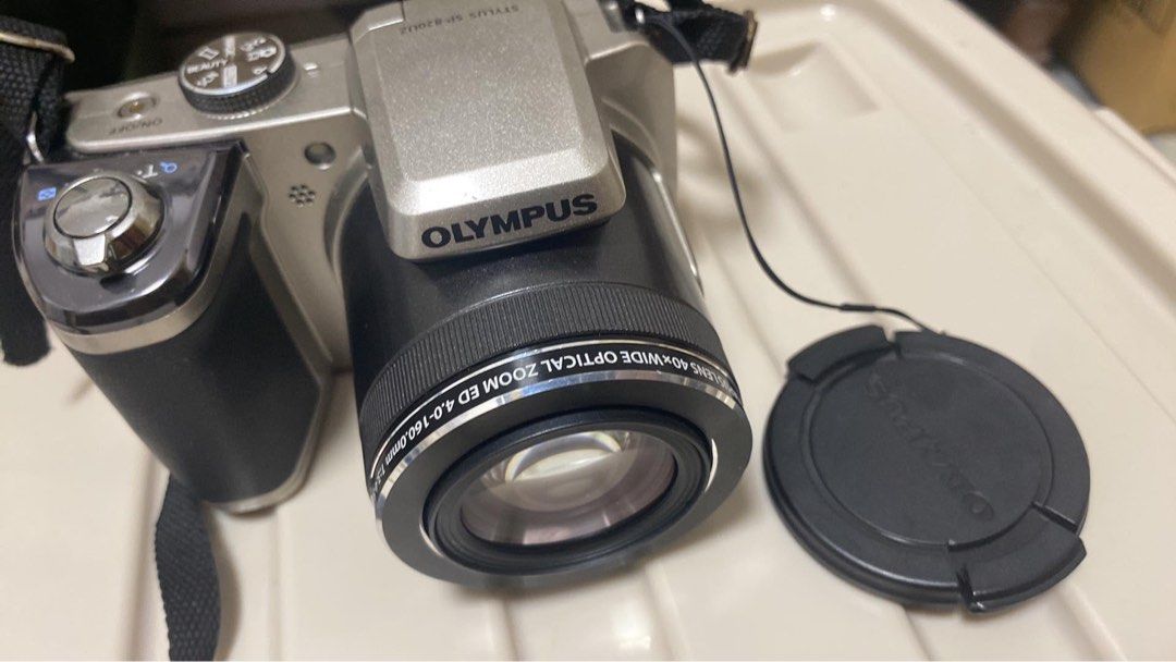 Olympus SP 820-UZ (Category: Cameras) located in San Fernando. Submitted by mightyghnat (Listing ID 1468802932, Image 1). Description: Olympus SP-820UZ Digital Camera – Long-Term Storage, Sold As-Is with the lens cover and strap for Parts/Repair Up for sale is an Olympus SP-820UZ compact superzoom digital camera. The camera is in perfect, mint cosmetic condition. It has been stored by me for years and was never used during that time. There are no