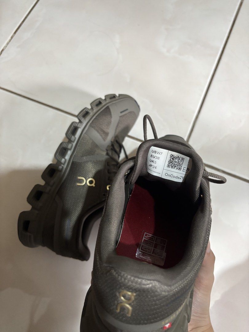 On Cloud Running Shoes Dark Olive US W7 (Category: Sneakers) located in Caloocan City. Submitted by lek_21 (Listing ID 1468921279, Image 3). Description: - Brand: On Running - Model: On Cloud - Color: Dark olive green with metallic gold logos/eyelets and burgundy insoles - Size: US W7 / EU38 / UK5 / JP24 - Features: Swiss engineering technology, lightweight mesh upper, and signature CloudTec sole cushioning - Condition: Minimal wear on soles - In