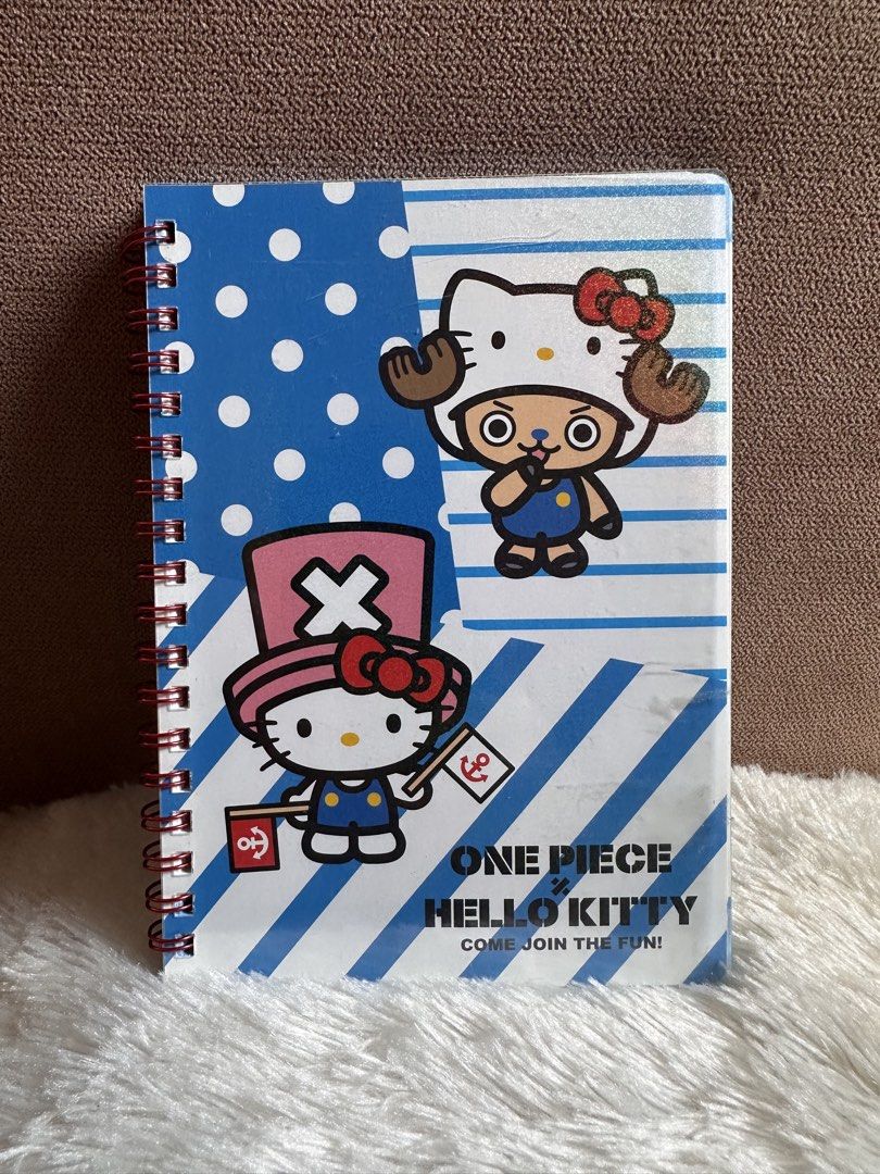 One Piece x Hello Kitty B6 Ring Notebook (Category: Character Goods) located in Davao. Submitted by favoritepreloved (Listing ID 1468769174, Image 1). Description: 💜 3pcs available 💜 18cm height x 13cm width.
