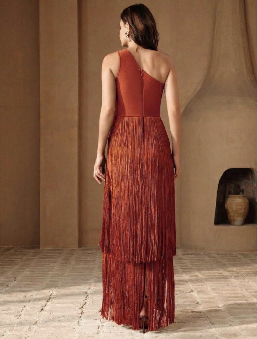 One shoulder burnt orange / rust fringe gown (Category: Dresses) located in Paranaque City. Submitted by leemillz (Listing ID 1468859887, Image 2). Description: Super unique fringe gown! Color: Rust orange Style: Asymmetric one-shoulder with fitted bodice and tiered fringe overlay Length: Midi length with a chic split hem Closure: Back zipper for easy wear Condition: Worn once for a wedding and got tonssss of compliments for a unique wedding gues