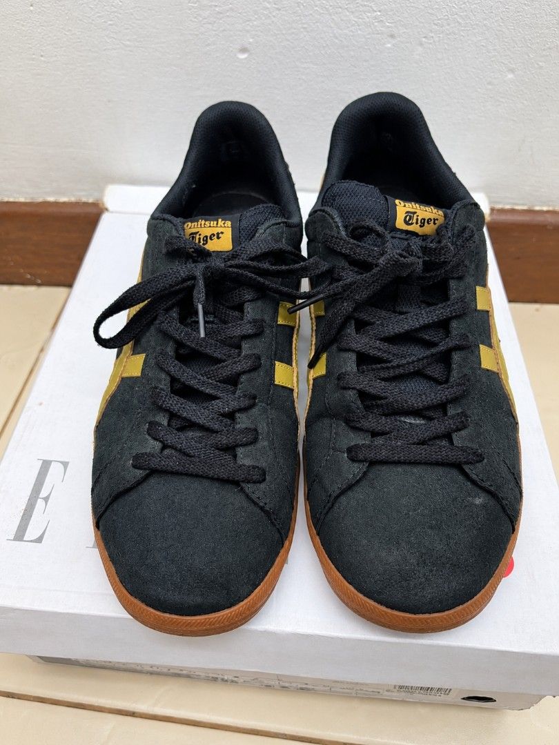 Onitsuka Tiger Black and Gold (Category: Sneakers) located in Paranaque City. Submitted by olracs_corner (Listing ID 1468816368, Image 1). Description: Size 10US / 44EURO / 28CM.