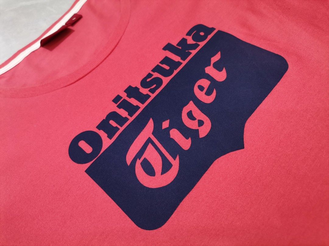 Onitsuka Tiger by ASICS (Category: Shirts) located in Iba. Submitted by selector_items (Listing ID 1468875888, Image 3). Description: *Brand*: Onitsuka Tiger by ASICS *Style*: Women's Short Sleeve Crew Neck Tee *Color*: Coral Red / Bright Red with Navy print *Details*: Big Onitsuka Tiger logo print on front, ribbed neckline, relaxed fit *Material*: 100% Cotton 棉 *Size*: M - Tag size: 160/84A (M) | Bust 80-86cm | Height 157-163cm *Measurements*: -