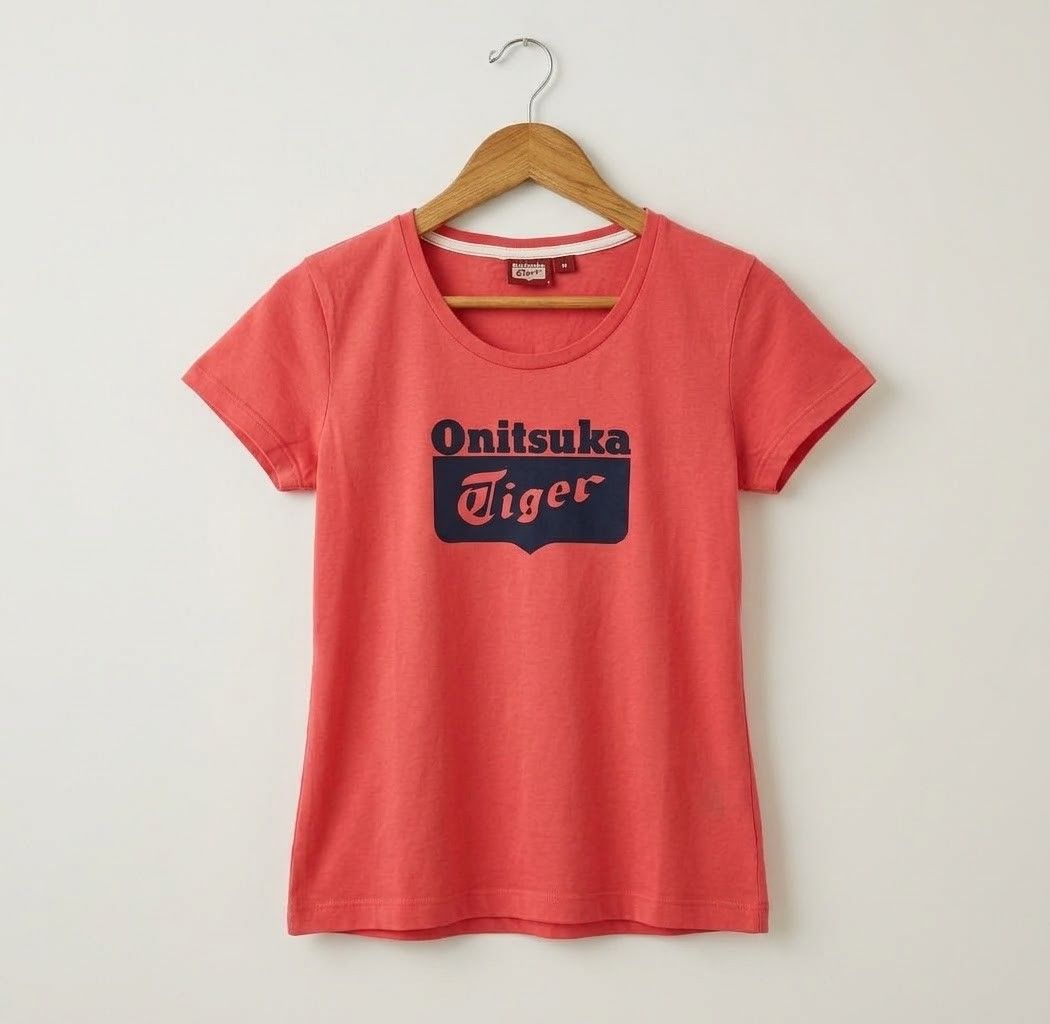 Onitsuka Tiger by ASICS (Category: Shirts) located in Iba. Submitted by selector_items (Listing ID 1468875888, Image 2). Description: *Brand*: Onitsuka Tiger by ASICS *Style*: Women's Short Sleeve Crew Neck Tee *Color*: Coral Red / Bright Red with Navy print *Details*: Big Onitsuka Tiger logo print on front, ribbed neckline, relaxed fit *Material*: 100% Cotton 棉 *Size*: M - Tag size: 160/84A (M) | Bust 80-86cm | Height 157-163cm *Measurements*: -