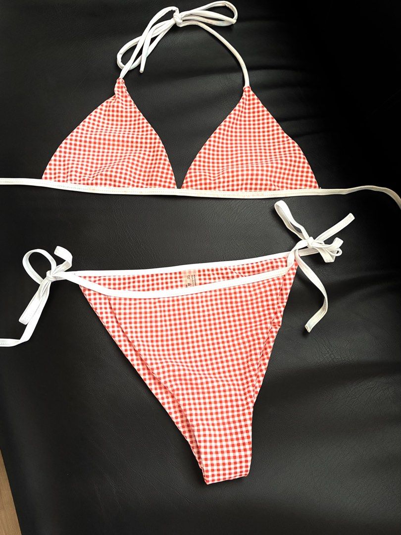 Orange and White Gingham Two-Piece Bikini (Category: Bikinis & Swimsuits) located in Tanauan. Submitted by theitgirlsdibs4 (Listing ID 1468738561, Image 1). Description: - Style: Red and white gingham print two-piece swimsuit - Top: Adjustable halter ties with chic white piping - Bottoms: Matching side-ties with adjustable coverage - Perfect for: Summer poolside lounging, beach days, and tropical vacations.