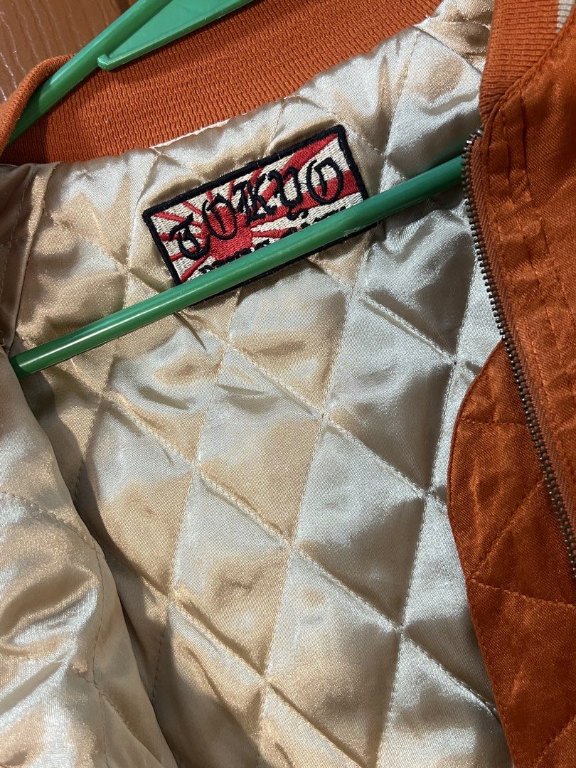 Orange Bomber Jacket (Category: Coats, Jackets and Outerwear) located in Marikina City. Submitted by yssacee (Listing ID 1468904000, Image 2). Description: - comfy, warm material, feels soft - great quality - fits XS, S unisex - PM for more pics/size inquiries - cute embroidered detail of Tiger - shipping from lower Antipolo Rizal.