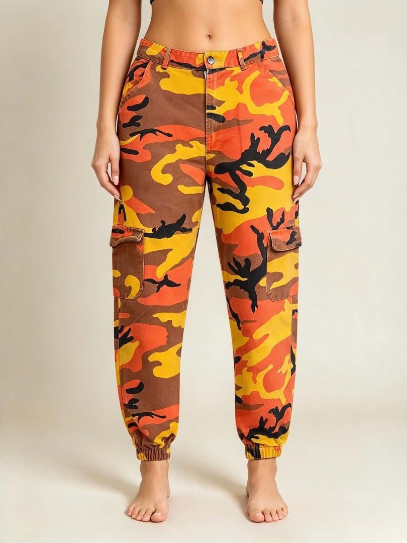Orange Camo Cargo Pants Utility Joggers (Category: Joggers) located in Caloocan City. Submitted by mylove326 (Listing ID 1468794121, Image 1). Description: - Vibrant orange camo print (orange, yellow, brown, and black) - fit with secure button and zipper closure - Practical utility pockets on both sides - Trendy elastic cuffs at the ankles - Made from durable, sturdy cotton material - Ultimate streetwear statement piece - Please refer to the pict