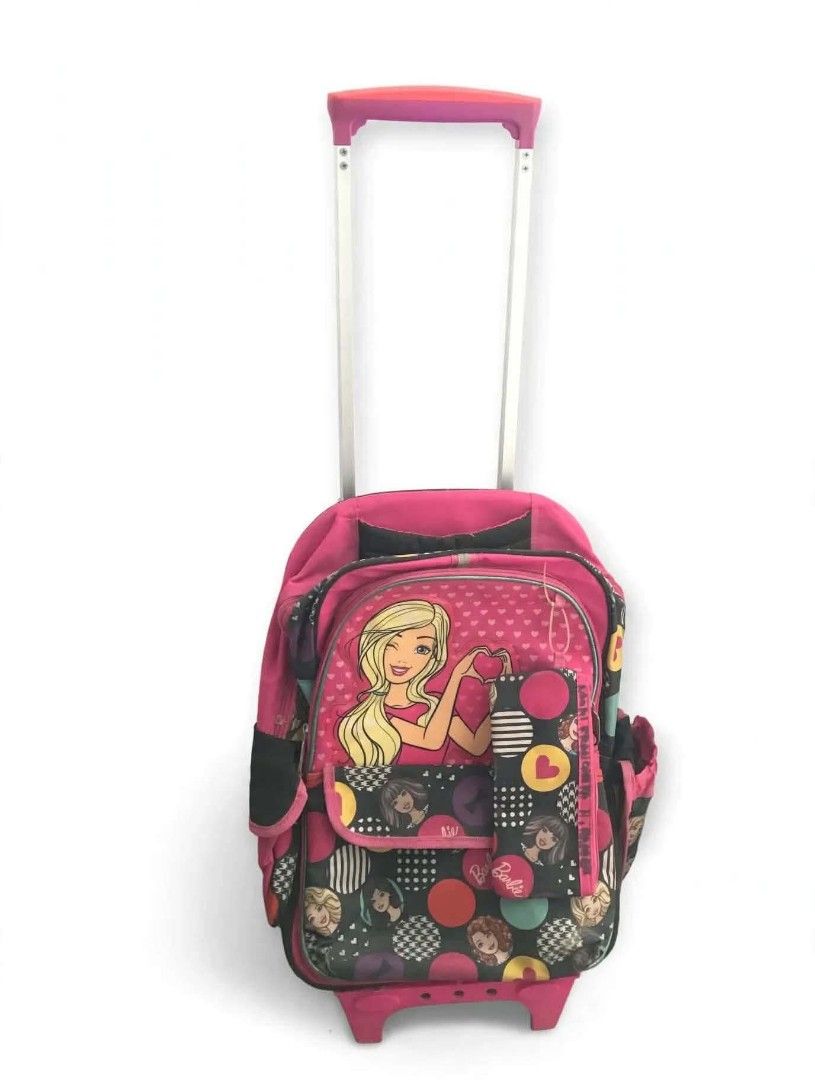 Original Barbie Trolley Bag School Backpack (Category: Backpacks) located in Las Pinas. Submitted by rejanesandro1981 (Listing ID 1468716413, Image 2). Description: - Authentic Barbie trolley bag in pink and black - Can be used as a pull-along trolley or a regular backpack with padded straps - Features a retractable handle and smooth-rolling wheels - All zippers are fully functional and the bag is in clean condition - Ideal size for daily school 