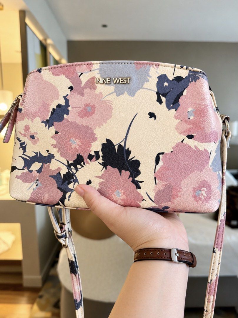 Original Nine West bag (Category: Cross-body Bags) located in Las Pinas. Submitted by yourdailyssentials (Listing ID 1468731759, Image 2). Description: Original Nine West bag ✅ 100% original, no to fake If you’re a girly tita, then you’d definitely love this bag for you 😉💯✨ - floral beige pink bag - preloved pero still looks good as new - sling bag / cross-body bag - imported from US - no issues - durable leather (hindi nag babakbak) - spacious