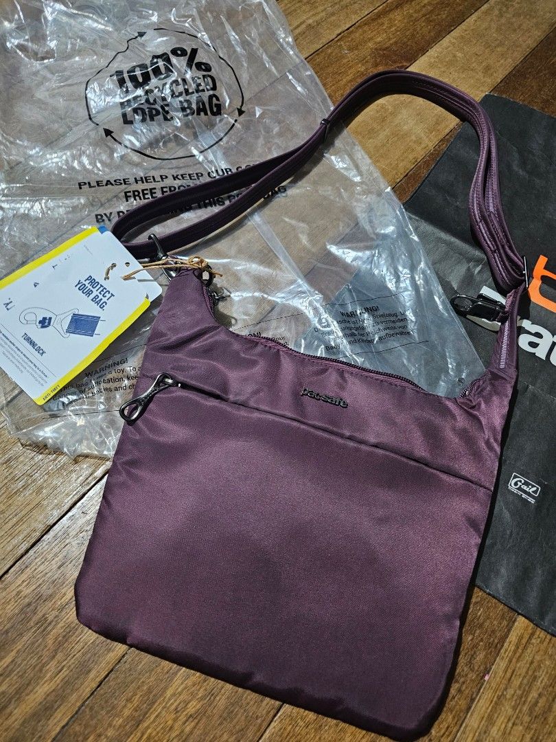 Pacsafe crossbody rfid sling bag (Category: Cross-body Bags) located in Manila. Submitted by onlinesmartshopping12 (Listing ID 1468881403, Image 2). Description: purple no issue.