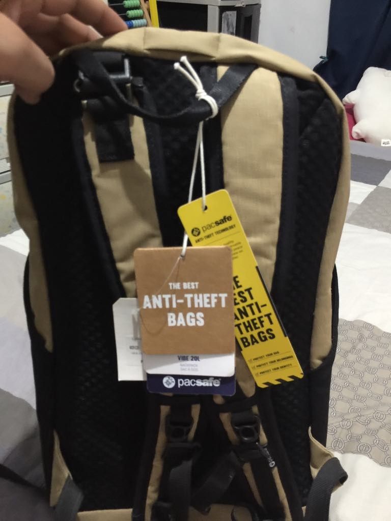 Pacsafe Vibe 20L Anti-Theft Backpack (Category: Backpacks) located in Las Pinas. Submitted by calmwolf_2a8740 (Listing ID 1468887633, Image 2). Description: - Brand: Pacsafe Vibe 20L Anti-Theft Backpack - Color: Tan and Black - Condition: Brand new with tags still attached (never used) - Eco-Friendly: Crafted from recycled plastic bottles - Security: Secure locking zippers on the main compartment - Comfort: Padded shoulder straps with a breathabl