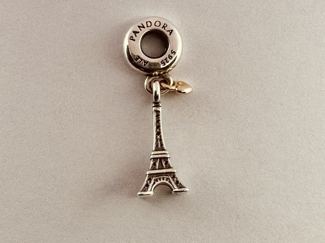 Pandora Paris Eiffel Tower Heart Dangle Charm (791302 (Category: Charms) located in Cabanatuan. Submitted by water.withahintoflime (Listing ID 1468884449, Image 2). Description: Retired|Authentic Sterling silver with 14k gold heart ❌ Issue ✅ Packaging.