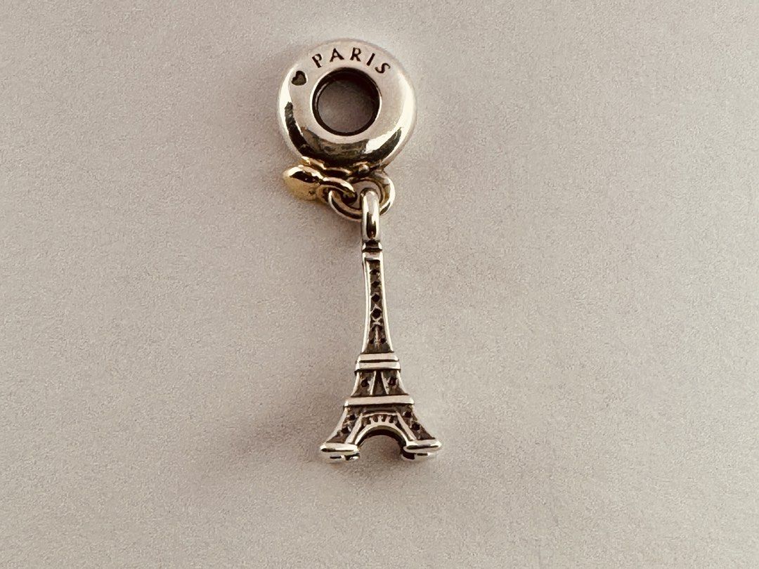 Pandora Paris Eiffel Tower Heart Dangle Charm (791302 (Category: Charms) located in Cabanatuan. Submitted by water.withahintoflime (Listing ID 1468884449, Image 1). Description: Retired|Authentic Sterling silver with 14k gold heart ❌ Issue ✅ Packaging.