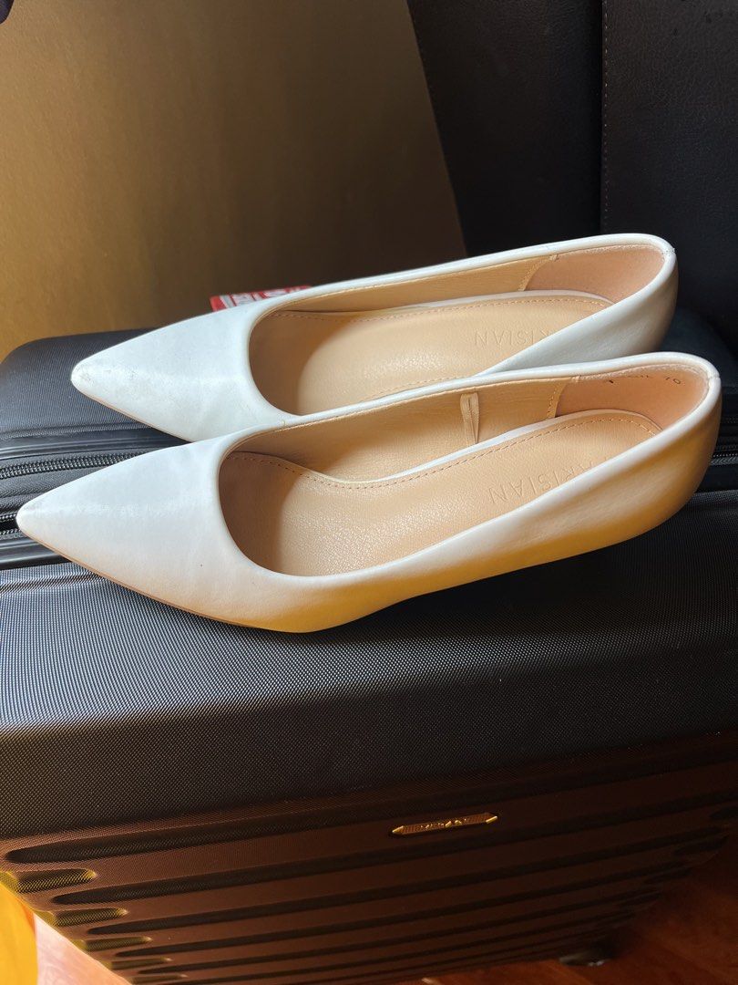 Parisian White Pointed Toe Kitten Heels Size 7 (Category: Heels) located in Manila. Submitted by snap_loved (Listing ID 1468740689, Image 2). Description: - Brand: Parisian - Size: US 7 - Color: Classic Solid White - Design: Pointed toe with short kitten heels - Condition: Clean inner soles with clear brand stamp; bottom soles show minor signs of previous wear - Versatility: Perfect for office wear, formal events, and casual chic outfits - Mode o