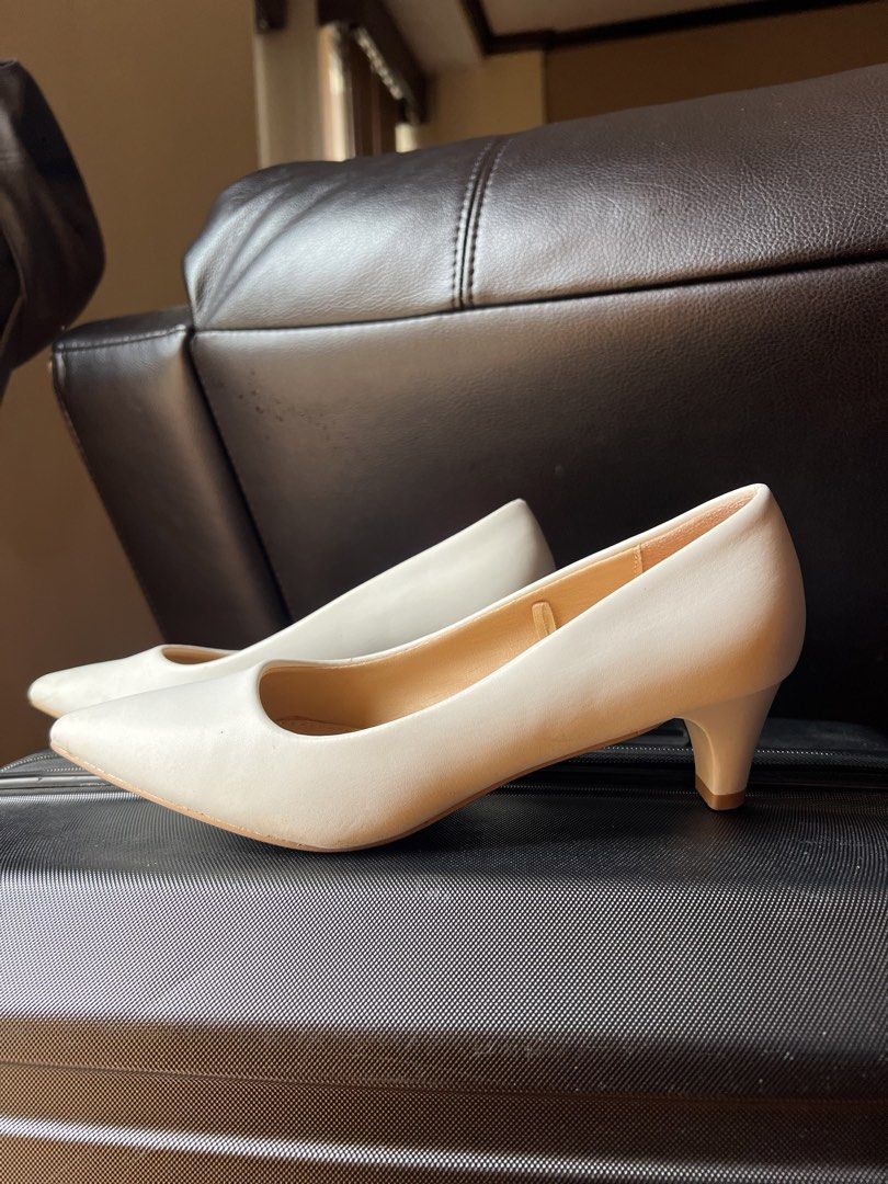 Parisian White Pointed Toe Kitten Heels Size 7 (Category: Heels) located in Manila. Submitted by snap_loved (Listing ID 1468740689, Image 1). Description: - Brand: Parisian - Size: US 7 - Color: Classic Solid White - Design: Pointed toe with short kitten heels - Condition: Clean inner soles with clear brand stamp; bottom soles show minor signs of previous wear - Versatility: Perfect for office wear, formal events, and casual chic outfits - Mode o