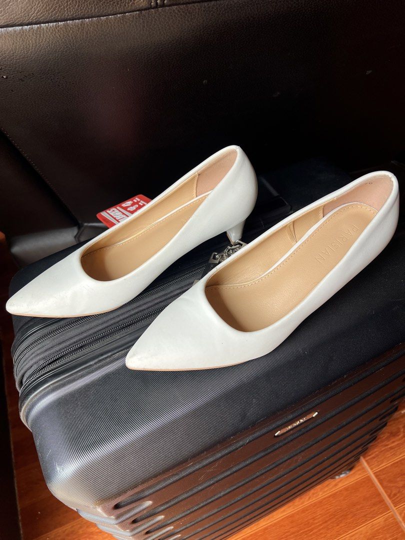 Parisian White Pointed Toe Kitten Heels Size 7 (Category: Heels) located in Manila. Submitted by snap_loved (Listing ID 1468740689, Image 3). Description: - Brand: Parisian - Size: US 7 - Color: Classic Solid White - Design: Pointed toe with short kitten heels - Condition: Clean inner soles with clear brand stamp; bottom soles show minor signs of previous wear - Versatility: Perfect for office wear, formal events, and casual chic outfits - Mode o