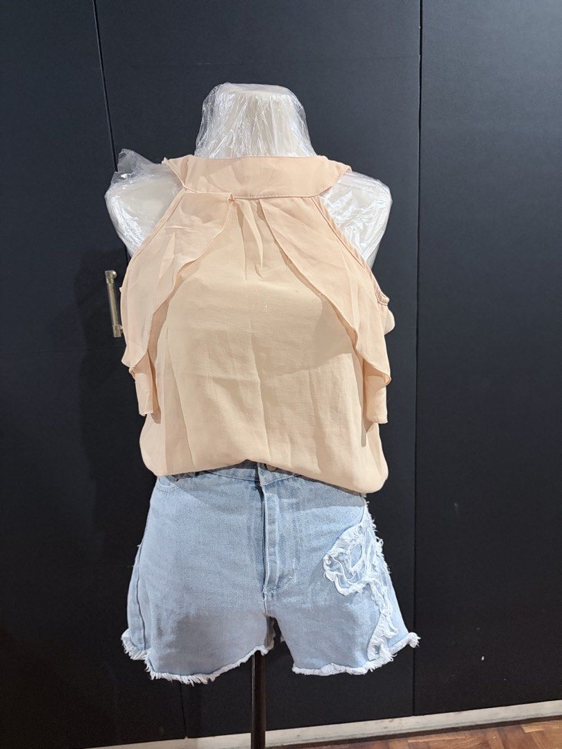 Peach halter top (Category: Sets or Coordinates) located in Manila. Submitted by everydaymeanseveryday (Listing ID 1468864926, Image 1). Description: - chiffon - Top features trendy layered ruffle details around the shoulders.