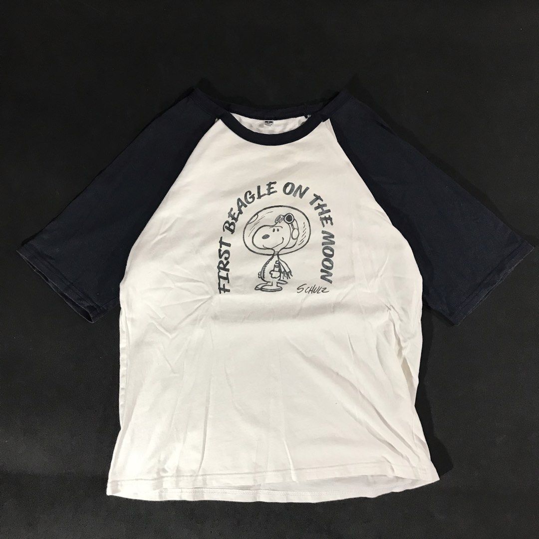 Peanuts Snoopy “First Beagle On The Moon” Raglan Shirt (Category: Tshirts & Polo Shirts ) located in Manila. Submitted by a_aron.f6e3a7 (Listing ID 1468786028, Image 1). Description: Size: Small Color rate: 9/10 (White body with Navy Blue sleeves and graphic print) Condition: Good pre-owned condition Issues: Visible wrinkles and creases from storage; no visible major holes or tears.