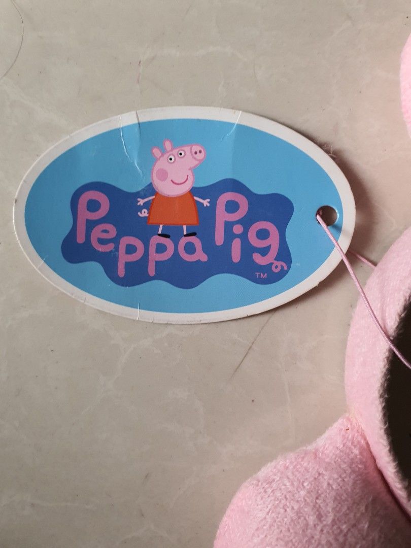 Peppa Pig Plush Ears Headband (Category: Hair Accessories) located in Meycauayan. Submitted by shoptoown (Listing ID 1468756504, Image 3). Description: - Official Peppa Pig merchandise by Astley Baker Davies Ltd - Features cute pink plush round ears on top - Brand new with original tag still attached - Made with soft, comfortable fabric material - Perfect gift or accessory for Peppa Pig fans.