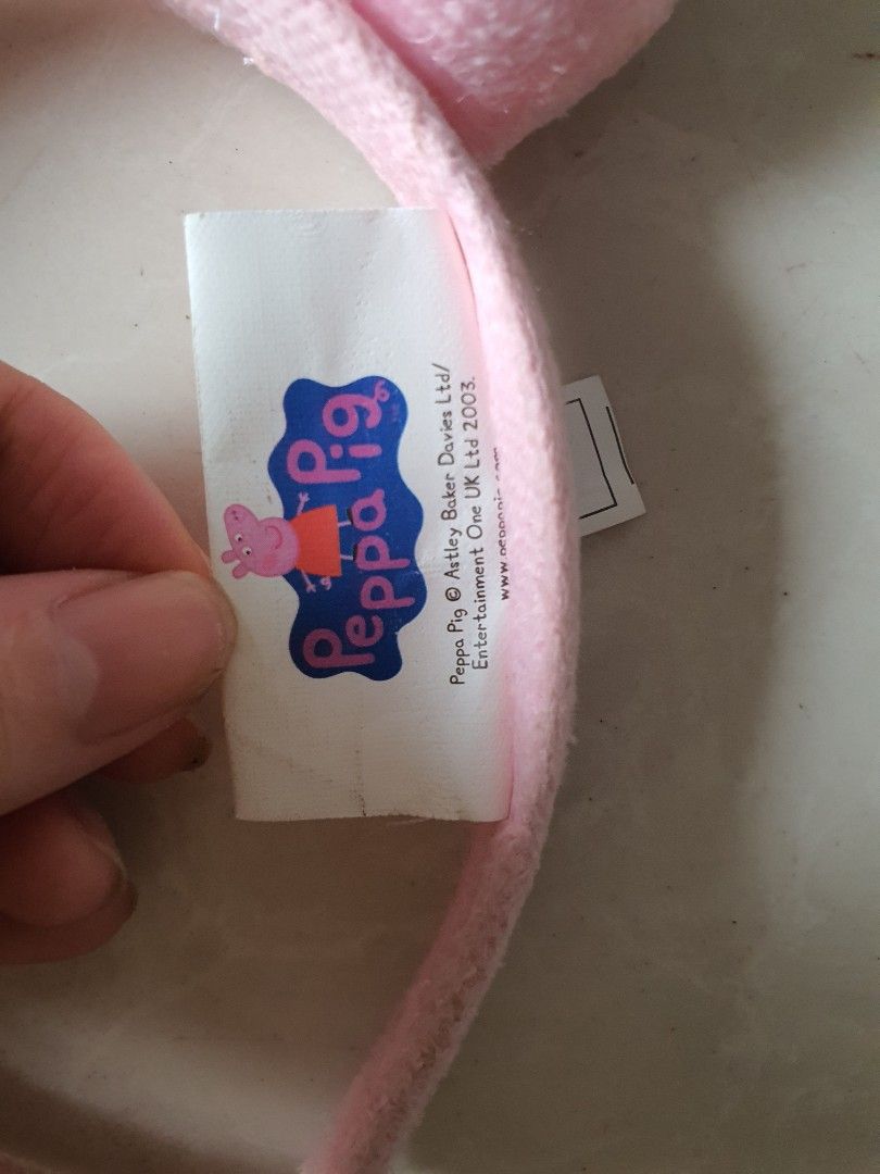 Peppa Pig Plush Ears Headband (Category: Hair Accessories) located in Meycauayan. Submitted by shoptoown (Listing ID 1468756504, Image 2). Description: - Official Peppa Pig merchandise by Astley Baker Davies Ltd - Features cute pink plush round ears on top - Brand new with original tag still attached - Made with soft, comfortable fabric material - Perfect gift or accessory for Peppa Pig fans.