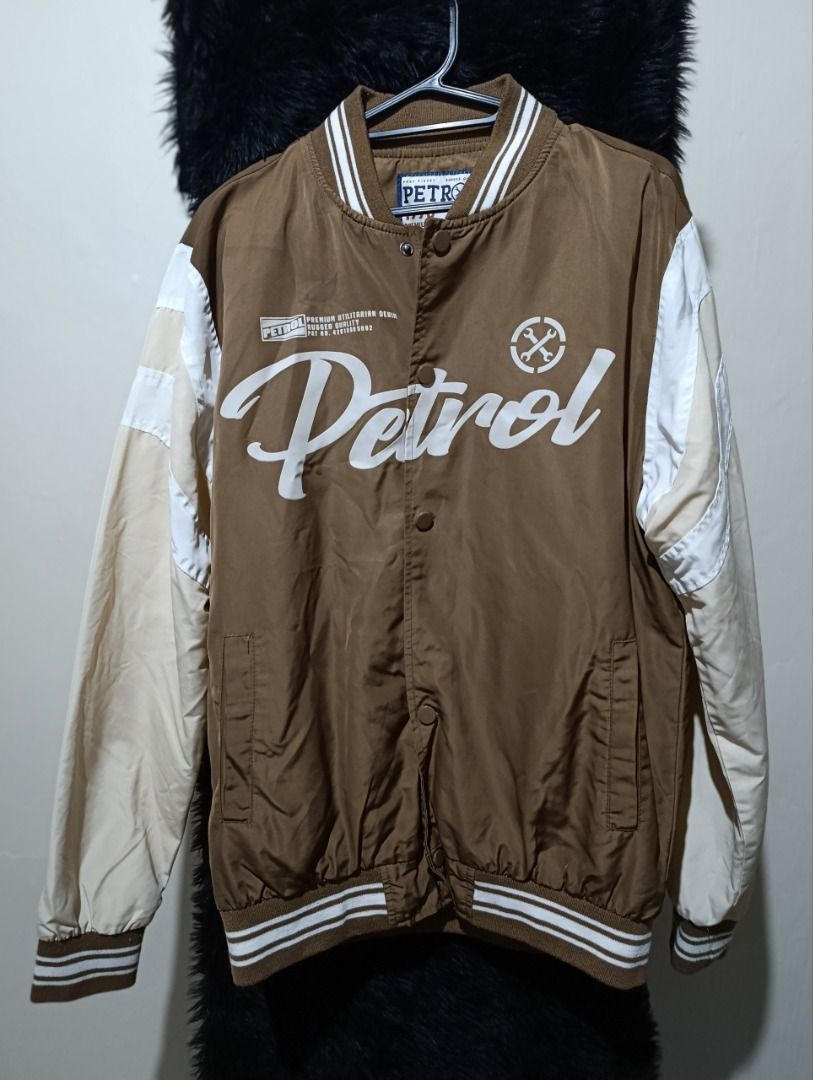Petrol Industries Brown White Bomber Jacket Size M (Category: Coats, Jackets and Outerwear) located in Iloilo. Submitted by jpk_ok_sales (Listing ID 1468808489, Image 1). Description: - Brand: Petrol Industries - Style: Brown and white bomber jacket - Size: Medium (tag inside collar) - Closure: Snap buttons down the front - Details: Large white chest graphics with script lettering - Pockets: Two front welt pockets - Trim: Striped ribbed cuffs and