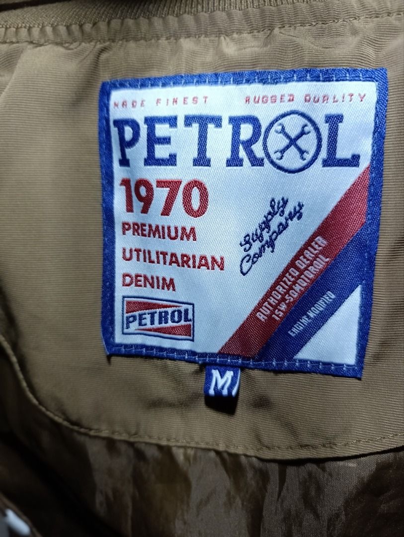 Petrol Industries Brown White Bomber Jacket Size M (Category: Coats, Jackets and Outerwear) located in Iloilo. Submitted by jpk_ok_sales (Listing ID 1468808489, Image 2). Description: - Brand: Petrol Industries - Style: Brown and white bomber jacket - Size: Medium (tag inside collar) - Closure: Snap buttons down the front - Details: Large white chest graphics with script lettering - Pockets: Two front welt pockets - Trim: Striped ribbed cuffs and