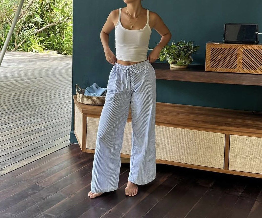 Phia the Label Striped Perfect Pants (Category: Jeans) located in Makati City. Submitted by lmrzlt (Listing ID 1468735176, Image 1). Description: - Color/Pattern: Blue and white stripes - Fit: Relaxed, wide-leg cut - Waistband: Elastic with front drawstring tie - Length: Full length - Material: Lightweight and super comfortable - Best for: Lounging at home or casual outings - Styling tip: Pairs easily with basic tank tops.