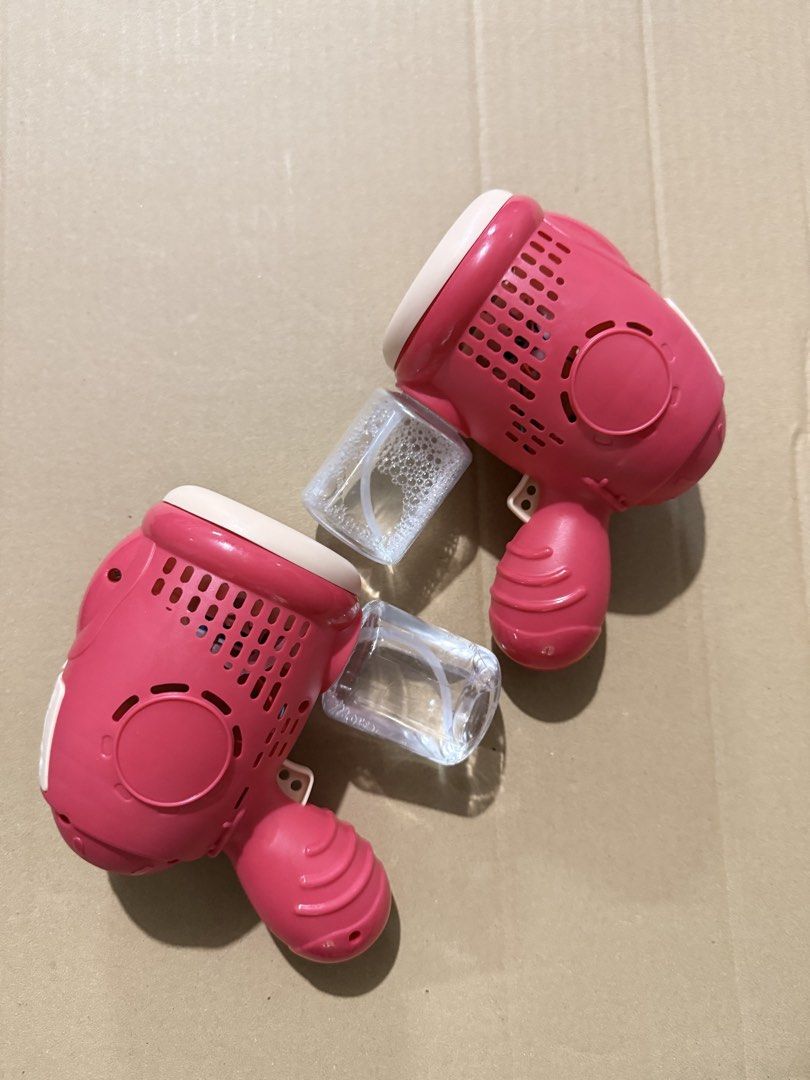 Pink Bubble Gun Toy with Liquid Container (Category: Kids Toys) located in Calamba. Submitted by itszygie (Listing ID 1468735168, Image 1). Description: Used only for photo op in church 2pcs for 150 With battery Need to buy bubble solution.