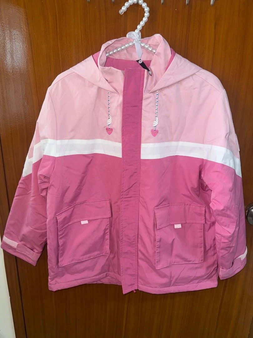 Pink colorblock hooded jacket with front pockets (Category: Coats, Jackets and Outerwear) located in Caloocan City. Submitted by mylove326 (Listing ID 1468795608, Image 3). Description: - Style: Cute pink and white colorblock jacket - Hood: Oversized hood with adorable heart pull strings - Pockets: Two functional front flap pockets - Closure: Front button-up with a hidden zipper under the placket.