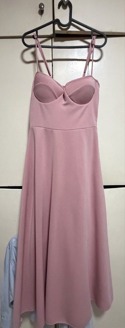 Pink Evening Gown (Category: Dresses) located in Paranaque City. Submitted by E8231 (Listing ID 1468850845, Image 1). Description: - Brand: Rated E (from Landmark) - Condition: Brand new with original tag (Original price: ₱2,998) - Color: Dusty pink - Style: Sleeveless with spaghetti straps, shaped bust cups, fitted bodice, and long flowing skirt - Flaws: None, unworn item.