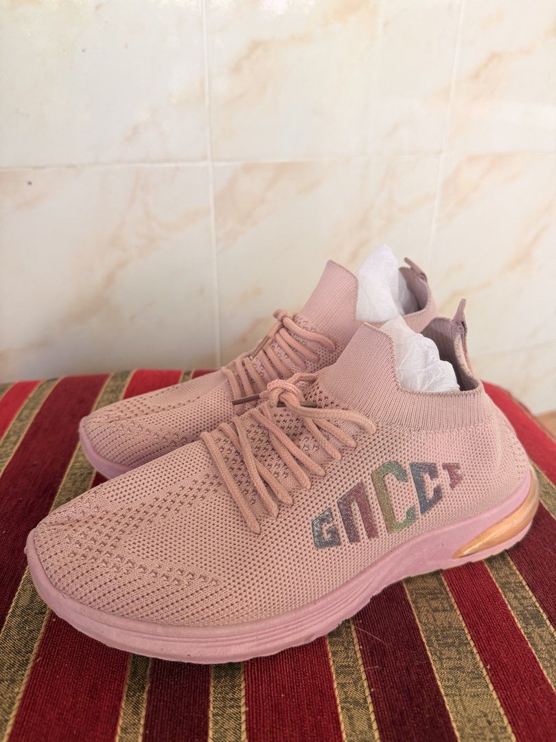 Pink Knit Slip-On Sneakers (Category: Sneakers) located in Manila. Submitted by sedpuprincess (Listing ID 1468783831, Image 2). Description: - Color: Pink with chic metallic side lettering - Design: Slip-on style with matching laces and a trendy chunky rose gold heel insert - Material: Lightweight and flexible knit upper for all-day comfort - Best For: Everyday walking and casual outfits - Condition: Carefully stored with paper stuffing inside to
