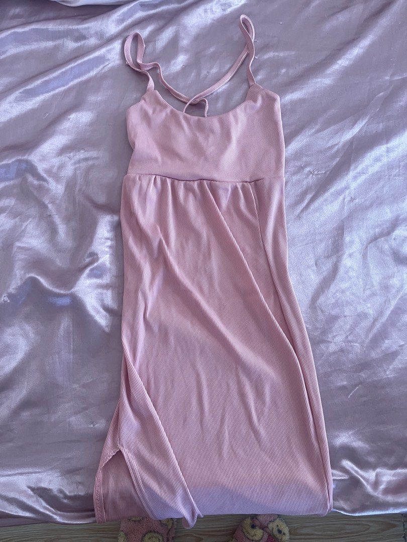 Pink Ribbed Midi Dress with Back Straps (Category: Dresses) located in Manila. Submitted by lovedbymidge (Listing ID 1468871116, Image 1). Description: 🩷 for xs-s girlies (worn once, in good condition) 🚚 lalamove or grab express (sf shouldered by the buyer!) - Dusty pink ribbed midi dress - Scoop neckline and sleeveless cut - Unique crisscross back straps with tie closure - Side slit for easy movement - Soft, stretchy, and unlined material.