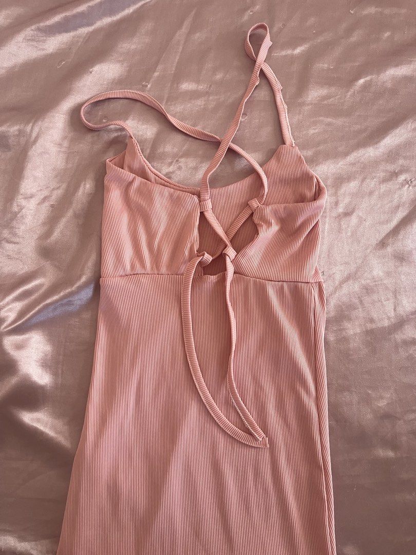 Pink Ribbed Midi Dress with Back Straps (Category: Dresses) located in Manila. Submitted by lovedbymidge (Listing ID 1468871116, Image 2). Description: 🩷 for xs-s girlies (worn once, in good condition) 🚚 lalamove or grab express (sf shouldered by the buyer!) - Dusty pink ribbed midi dress - Scoop neckline and sleeveless cut - Unique crisscross back straps with tie closure - Side slit for easy movement - Soft, stretchy, and unlined material.
