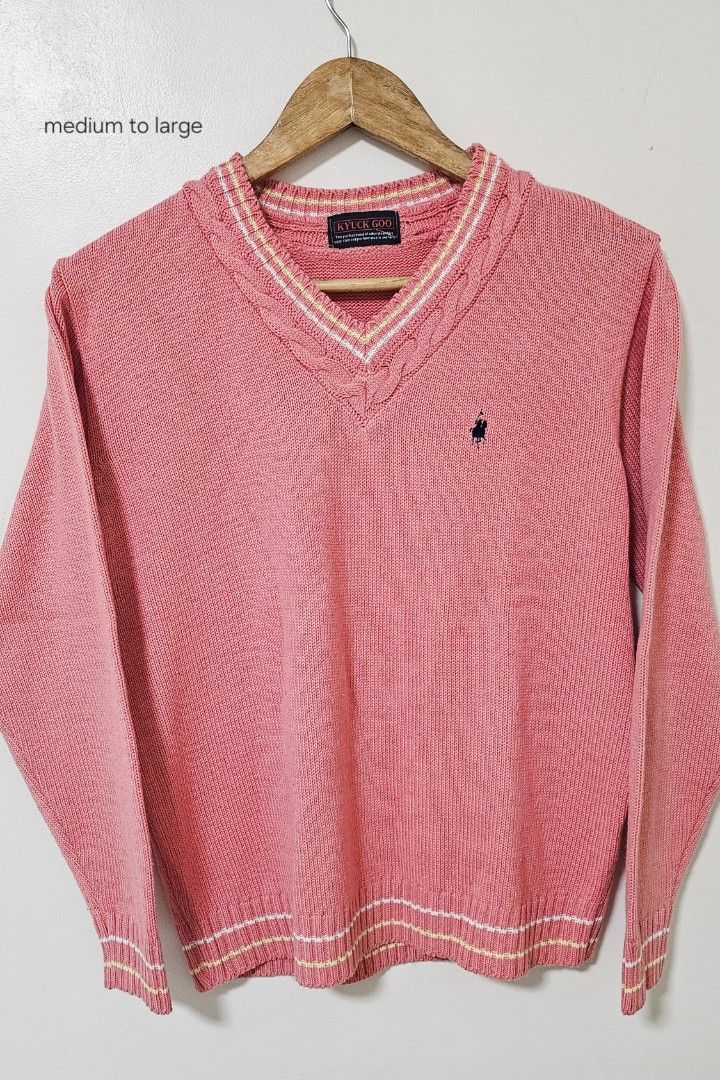 Pink V-Neck Sweater Medium to Large (Category: Coats, Jackets and Outerwear) located in Laoag. Submitted by __baptistakim (Listing ID 1468821206, Image 1). Description: Kyuck Goo V-neck sweater in pink. Cable knit collar detail with striped trim in white and yellow. Matching stripes along the cuffs and bottom hem. Small embroidered horse logo on the left chest. Knit fabric with long sleeves. Size tag indicates medium to large fit. Clean piece, re