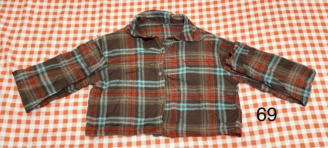 Plaid Button-Up Cropped Shirt Brown (Category: Longsleeves) located in Quezon City. Submitted by itsmesummeeer (Listing ID 1468838810, Image 1). Description: - Style: Brown plaid crop top with eye-catching blue and red checks - Design: Button-up front, classic collar, and long sleeves - Feel: Soft, worn-in material - Versatility: Perfect for layering over tanks or wearing solo - Size: L&W - 14.5”, Sleeves - 22”.